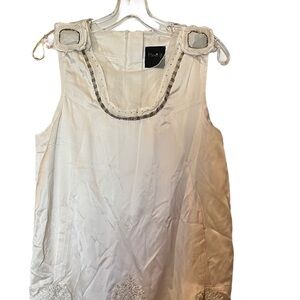 White silk sleeveless cocktail dress.
